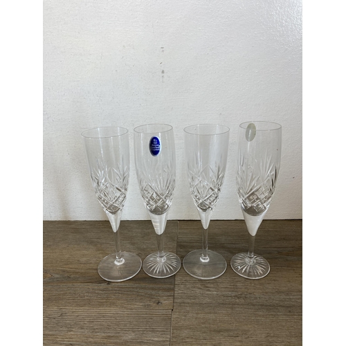 397 - A collection of glassware to include three paperweights, two Caithness vases, two Deco Art Designs v... 