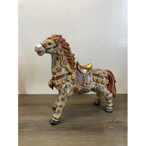 398 - A pair of Oriental porcelain horse figurines - approx. 45cm high