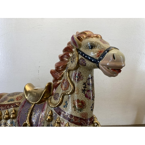 398 - A pair of Oriental porcelain horse figurines - approx. 45cm high