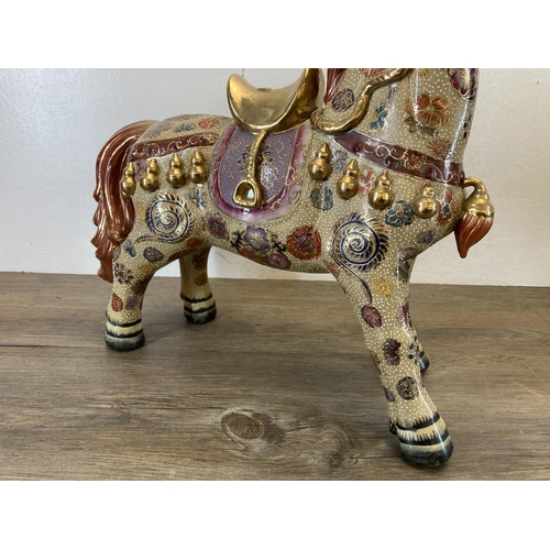 398 - A pair of Oriental porcelain horse figurines - approx. 45cm high