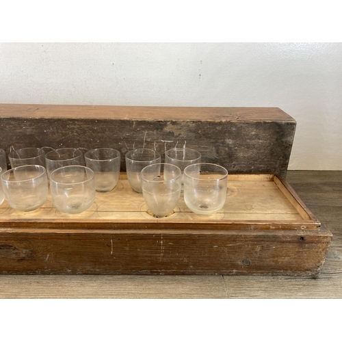 401 - A 19th century pine cased musical glass set - approx. 20cm high x 107cm wide x 20cm deep