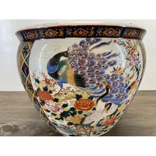 401A - An Oriental porcelain fish bowl jardinière - approx. 24cm high x 30cm diameter