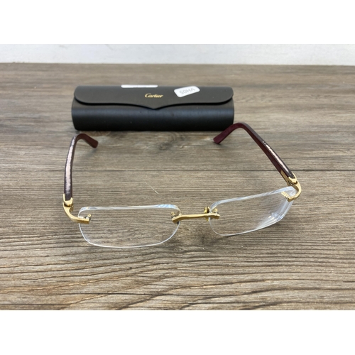 481 - A pair of cased Cartier reading glasses