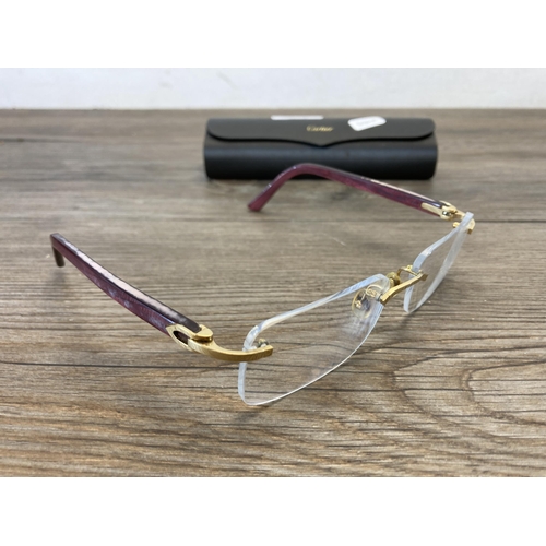 481 - A pair of cased Cartier reading glasses