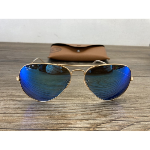 482 - A pair of cased Ray Ban Aviator sunglasses