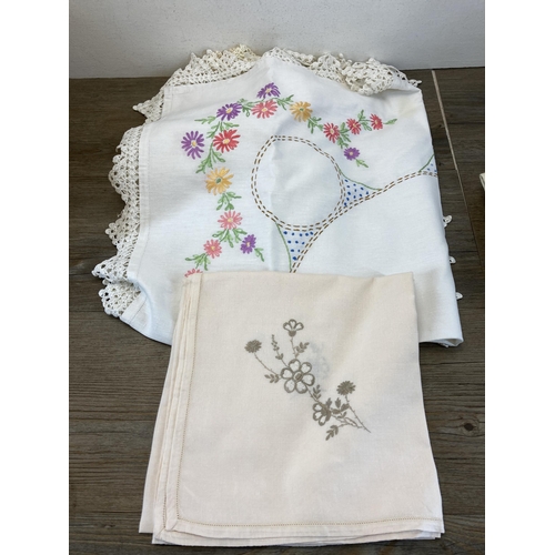 486 - A collection of vintage table linen to include embroidered lace etc.