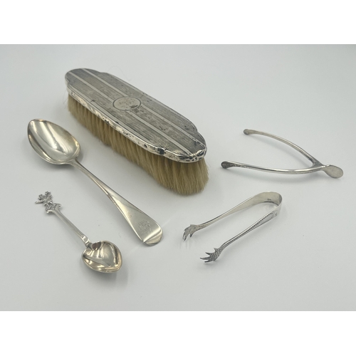 2291 - Five hallmarked sterling silver items, two spoons, two sugar tongs and one brush - approx. gross sil... 