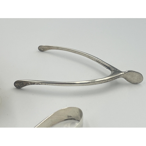 2291 - Five hallmarked sterling silver items, two spoons, two sugar tongs and one brush - approx. gross sil... 