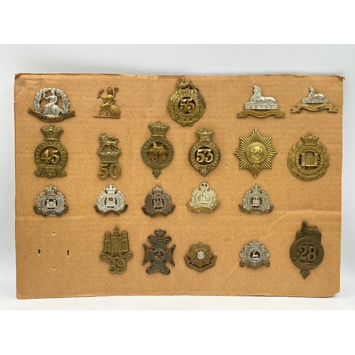 2136B - Twenty military cap badges