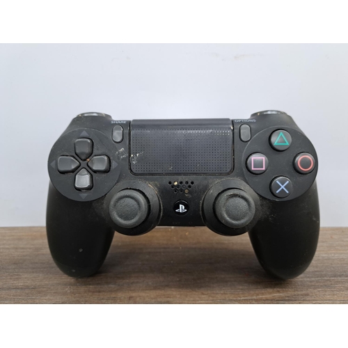 720 - A Sony PlayStation 4 Pro console with DualShock 4 controller