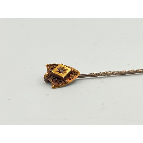 2498A - A late 19th/early 20th century 15ct gold diamond set stick pin - approx. gross weight 1g