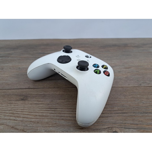 729 - Two Microsoft Xbox Series X/S controllers, one PowerA Spectra Enhanced wired and one white Microsoft... 