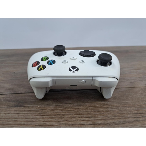 729 - Two Microsoft Xbox Series X/S controllers, one PowerA Spectra Enhanced wired and one white Microsoft... 