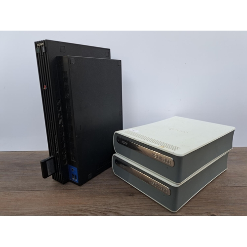 732 - A box containing Sony PlayStation 2 console with three controllers and cables, two Microsoft Xbox 36... 