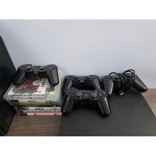 740 - Two Sony PlayStation 3 consoles, one Slim and one original with cables, four controllers, three Dual... 