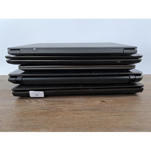 754 - Five laptops and notebooks to include Dell Vostro 5468, HP 650, Lenovo V14-ADA etc.