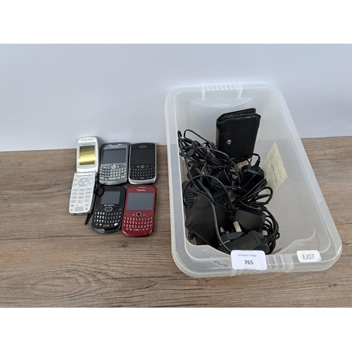 765 - A collection of mobile phones and chargers to include BlackBerry, Sony Ericsson etc.