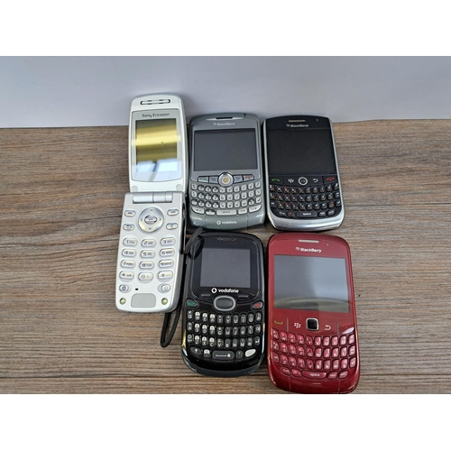 765 - A collection of mobile phones and chargers to include BlackBerry, Sony Ericsson etc.