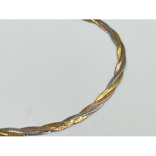 2498D - A hallmarked 9ct tri-colour gold bracelet - approx. gross weight 1.35g