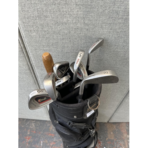 859 - A Regal golf bag containing Wilson, Mizuno and Callaway golf clubs