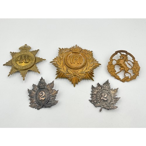 2175C - Five Canadian military cap and helmet badges