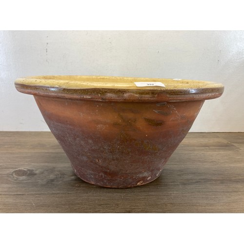 392 - A 19th century salt glazed terracotta dairy bowl - approx. 22cm high x 42cm diameter