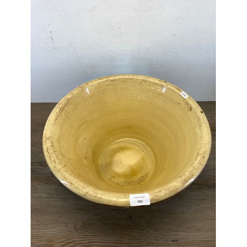 392 - A 19th century salt glazed terracotta dairy bowl - approx. 22cm high x 42cm diameter