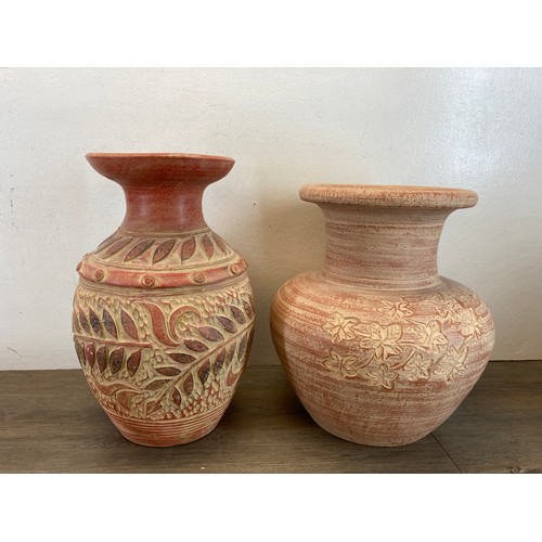 393 - Four pieces of modern ceramics, two terracotta vases - largest approx. 37cm high, one stoneware vase... 