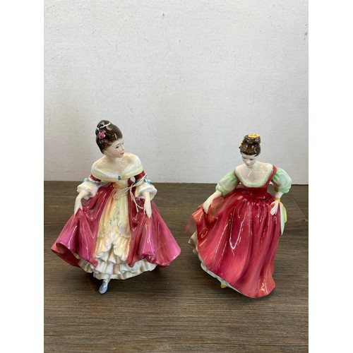 395 - Five Royal Doulton figurines, Christmas Morn HN1992, Janine HN2461, Southern Belle HN2229, Fair Lady... 