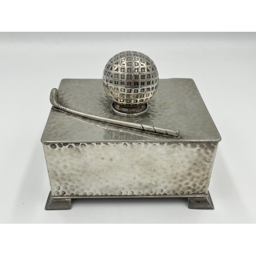 2294 - An early 20th century Civic Pewter No. 1640 hammered pewter novelty golf club and ball cigarette box... 