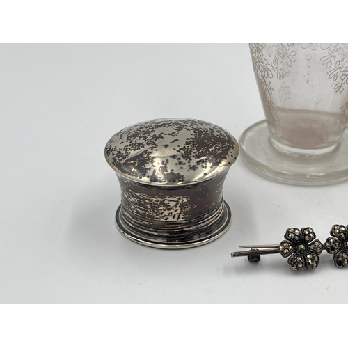 2298 - Five silver items, two brooches, one hallmarked London scent bottle top, one etched glass scent bott... 