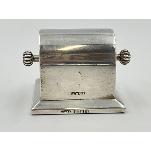 2299 - An Edwardian Charles & George Asprey hallmarked London silver stamp roll dispenser, dated 1903