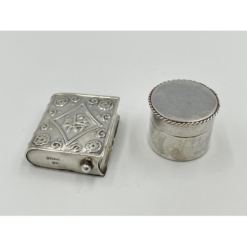 2300 - Two antique items, one white metal pill box with lidded top and one snuff box pendant in the form of... 