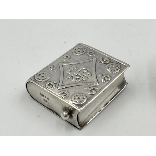 2300 - Two antique items, one white metal pill box with lidded top and one snuff box pendant in the form of... 