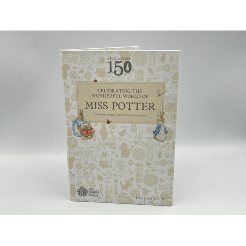 2303 - Three The Royal Mint Beatrix Potter 50p coin items, one Celebrating The Wonder World of Miss Potter ... 