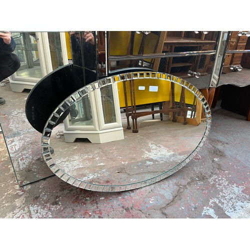 137D - A contemporary bevelled edge oval wall mirror - approx. 52cm high x 80cm wide