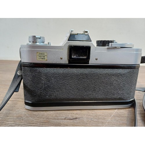 617 - A Canon FTb QL 35mm SLR camera fitted with 50mm 1:1.8 lens