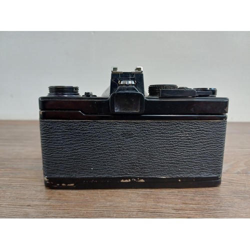 621 - An Olympus OM-1 35mm SLR camera fitted with Zuiko f=50mm 1:1.8 Auto-S lens