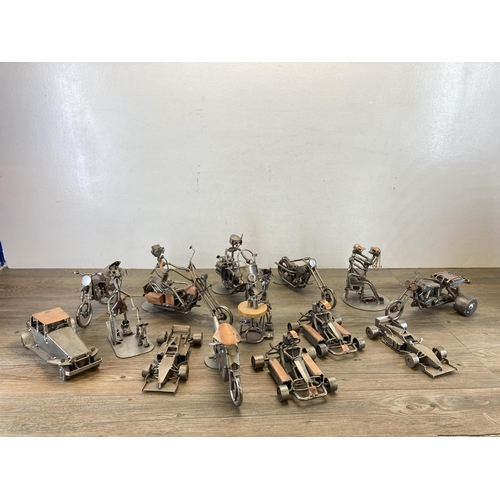 406 - A collection of handmade metal sculptures to include motorbikes, cars etc.