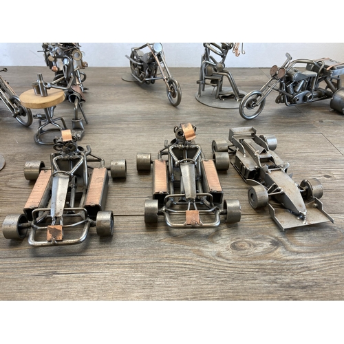 406 - A collection of handmade metal sculptures to include motorbikes, cars etc.