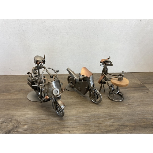 406 - A collection of handmade metal sculptures to include motorbikes, cars etc.