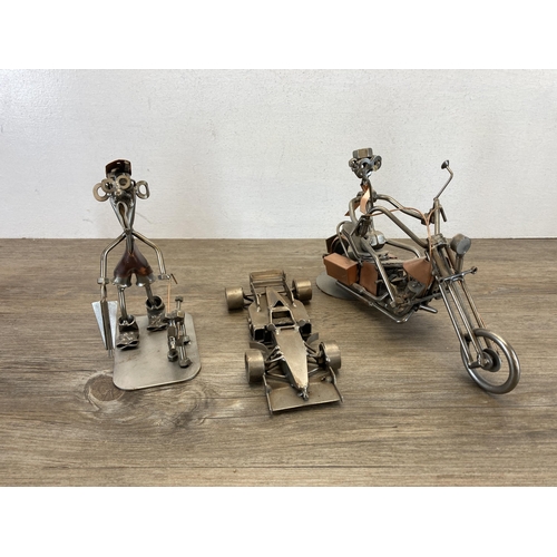 406 - A collection of handmade metal sculptures to include motorbikes, cars etc.