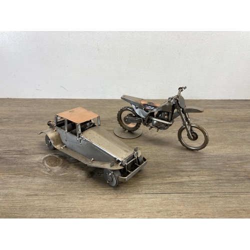 406 - A collection of handmade metal sculptures to include motorbikes, cars etc.