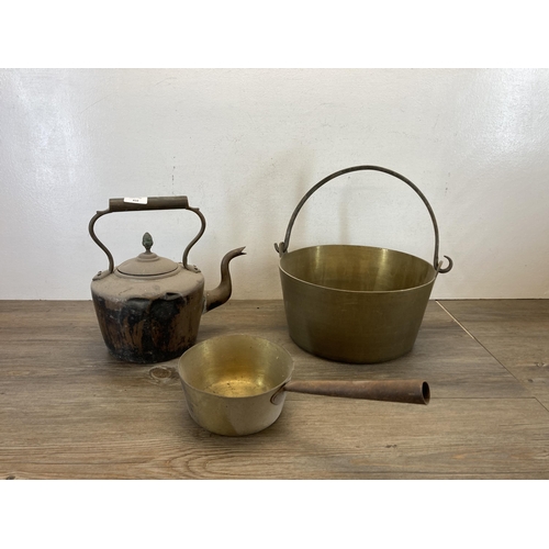 410 - Three pieces of 19th century metalware, one handled saucepan, one copper kettle and one preserve pan