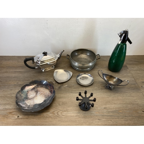 411 - Eight pieces of metalware to include mid 20th century soda syphon, early 20th century teapot, Sheffi... 