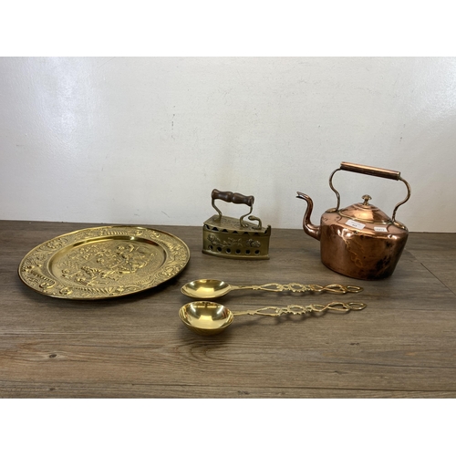 413 - Five pieces of 19th century and later metalware to include copper kettle, embossed brass wall charge... 