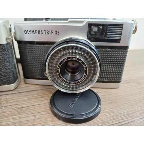 629 - Four vintage 35mm compact cameras, one cased Hanimex Compact A, two cased Olympus Trip 35 and one Ko... 