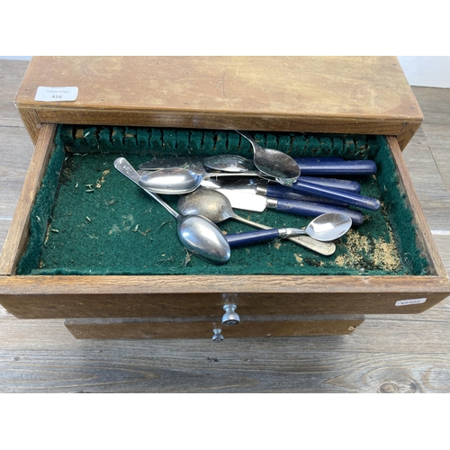 416 - A mid 20th century oak four drawer canteen of cutlery