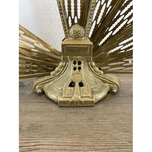 426 - A 19th century brass peacock fire screen - approx. 68cm high