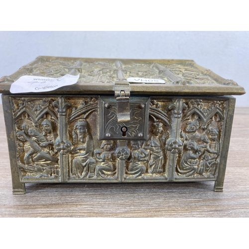 427C - A 19th century Gothic Revival Adolph Frankau & Co. brass casket shaped jewellery box with red velvet... 